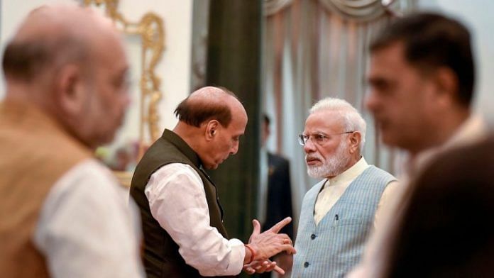 File image of Prime Minister Narendra Modi with Defence Minister Rajnath Singh, with Home Minister Amit Shah (in the background) | Atul Yadav | PTI