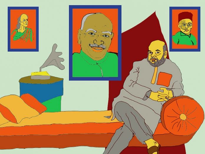 A sketch depicts Amit Shah with pictures of Veer Savarkar, Chanakya and Kamraj in the background.