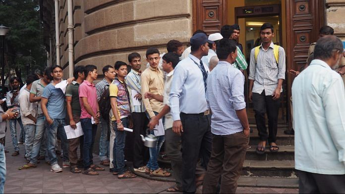 A queue of people stand outside a bank to exchange old notes in 2016 after the government announced the demonetisation scheme.