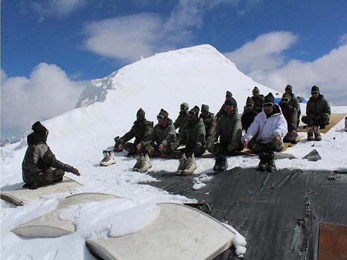 Soldiers doing yoga in the snow