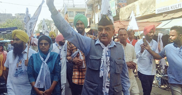 Maj Gen Suresh Khajuria in Gurdaspur waving to people while on the campaign trail. He secured a little over 23,000 votes