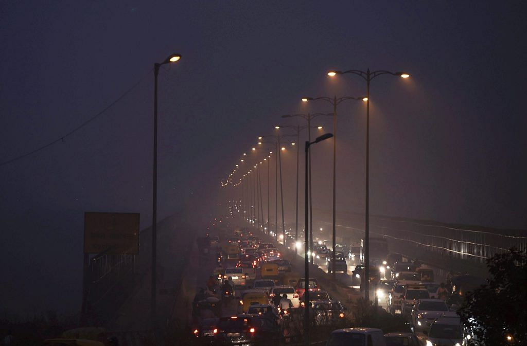 Cars in traffic in smog