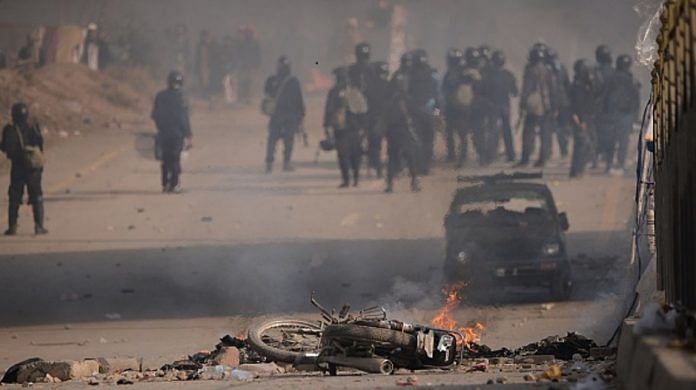 Pakistani security forces clash with protesters.