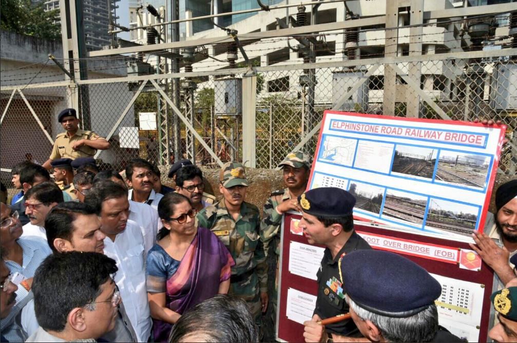 Ministers announcing the Indian Army building bridges at Elphinstone bridge in Mumbai