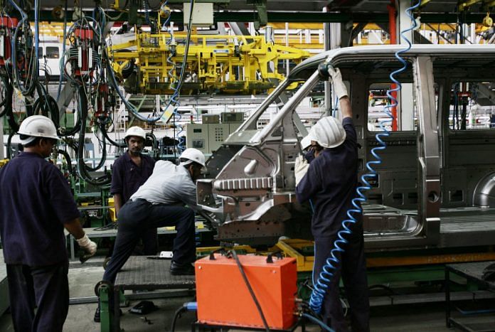 Workers in a car factory
