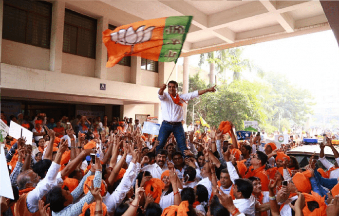 Politician celebrating with crowd