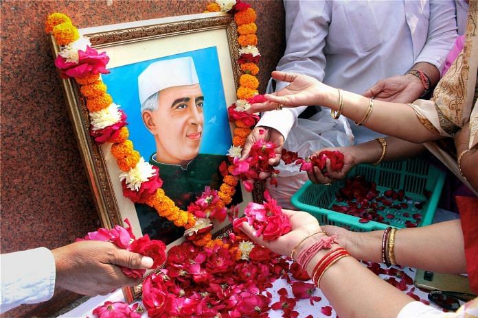Congress party workers paying tribute to the first prime minister Pandit Jawaharlal Nehru