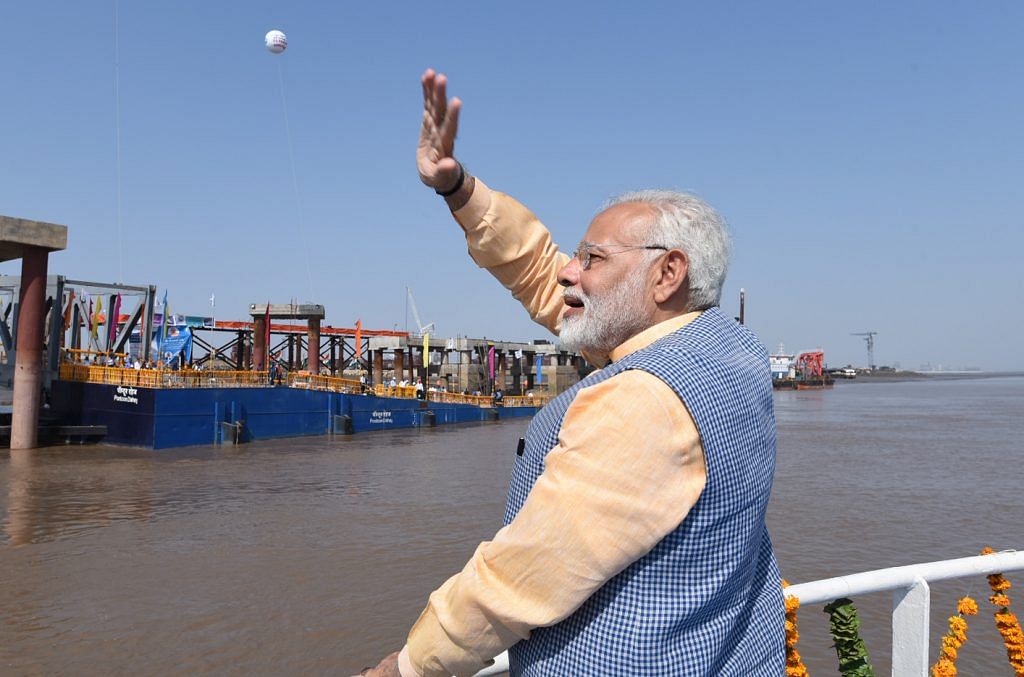 Narendra Modi waves from ferry