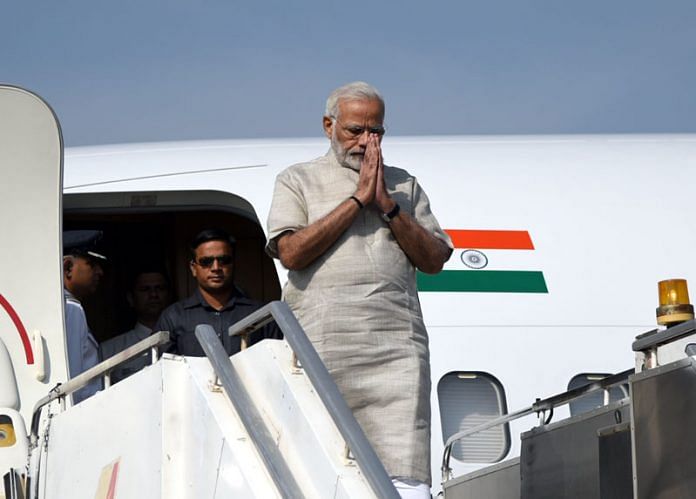 PM Narendra Modi de-boarding a plane in Jamnagar, Gujarat.