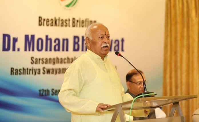 Mohan Bhagwat speaking on a podium
