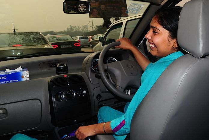 A woman driving a car