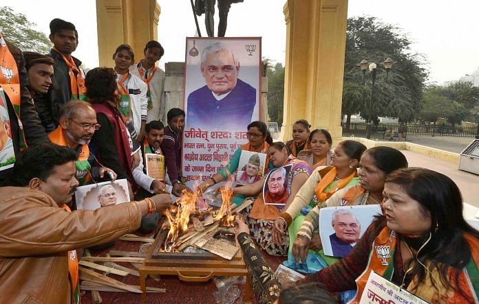 People gathered around a picture of Atal Bihari Vijpayee, conducting a hawan for his birthday eve