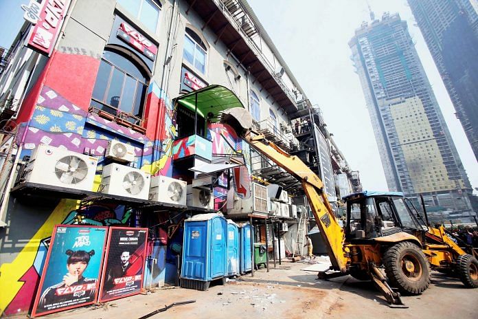 Demolition at Kamala Mills compound following the fire incident, in Mumbai.