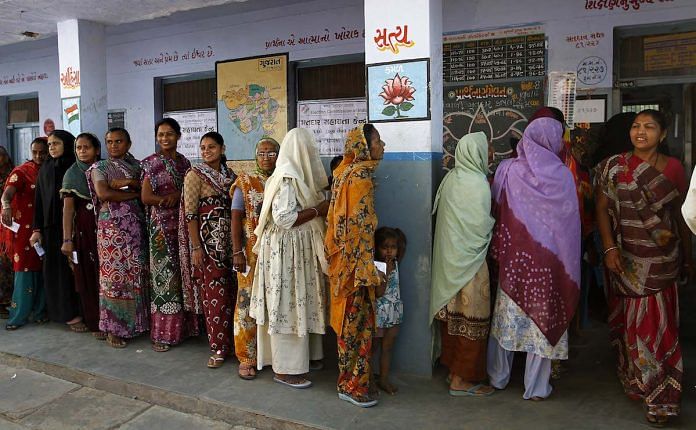 Voters standing in queue to cast their vote.