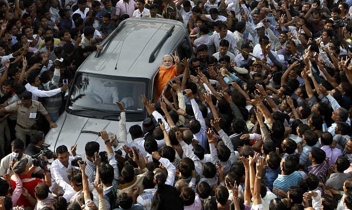 A crowd around Narendra Modi's car in Ahmedabad