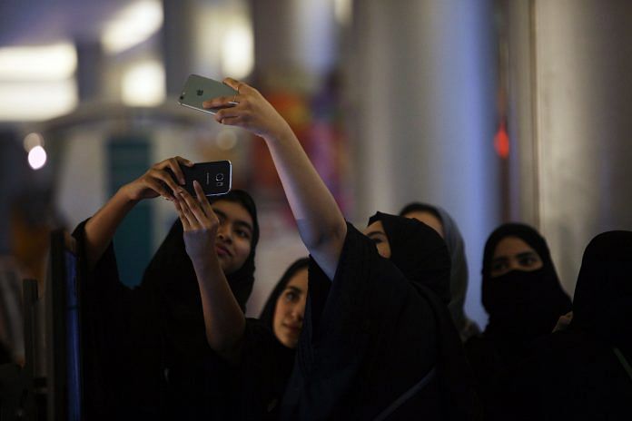 Saudi women take a selfie picture at a mall.