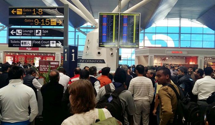 Passengers waiting at IGI Airport.