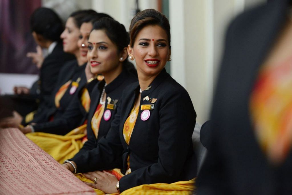 Female Indian flight attendant looking into the camera