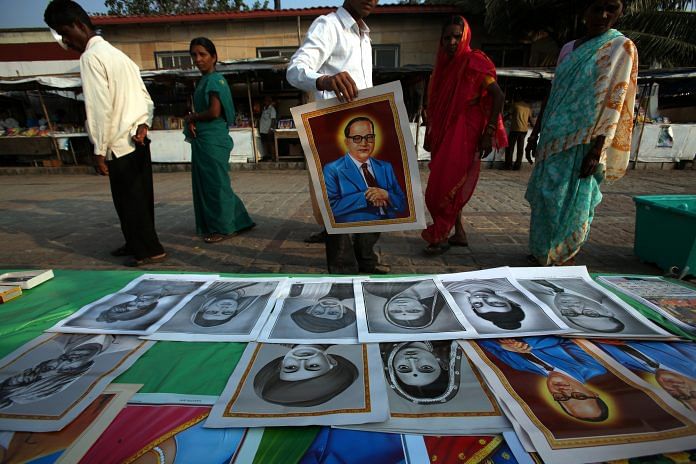 Devotees of Ambedkar buy posters in Mumbai.