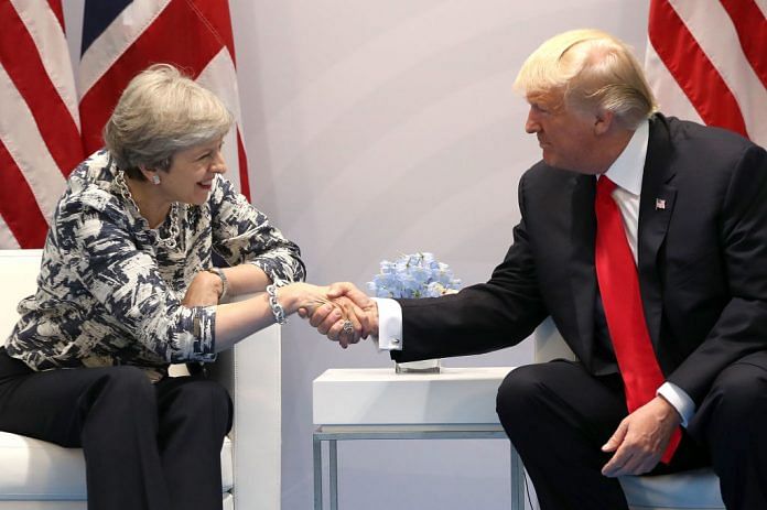 Trump and May shaking hands