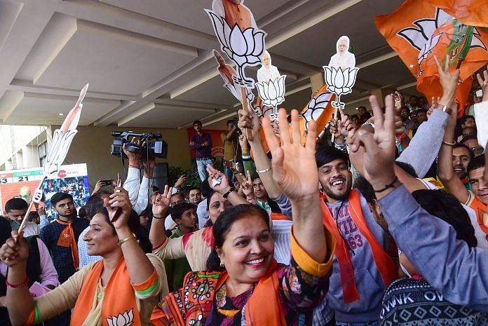 BJP workers celebrate their victory in the Assembly elections