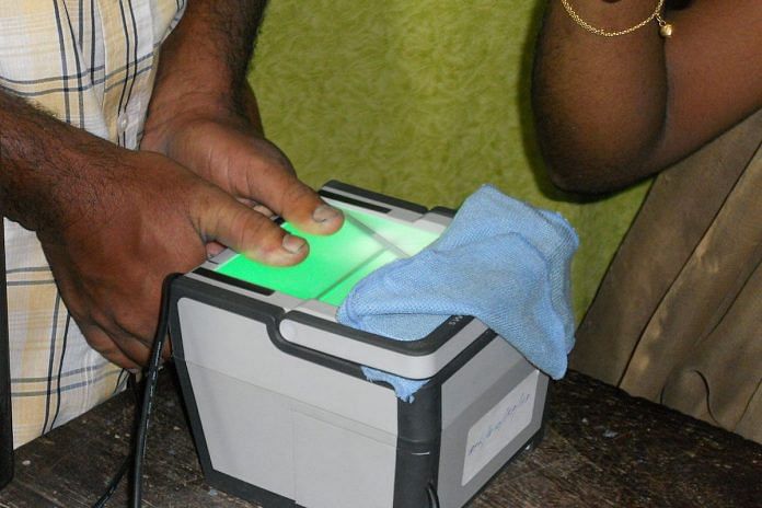 A person giving biometrics for Aadhaar