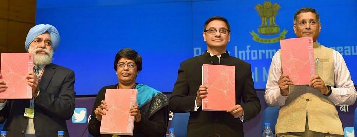Chief Economic Adviser Arvind Subramanian with finance ministry officials hold copies of annual Economic Survey 2017-18 that was tabled in Parliament