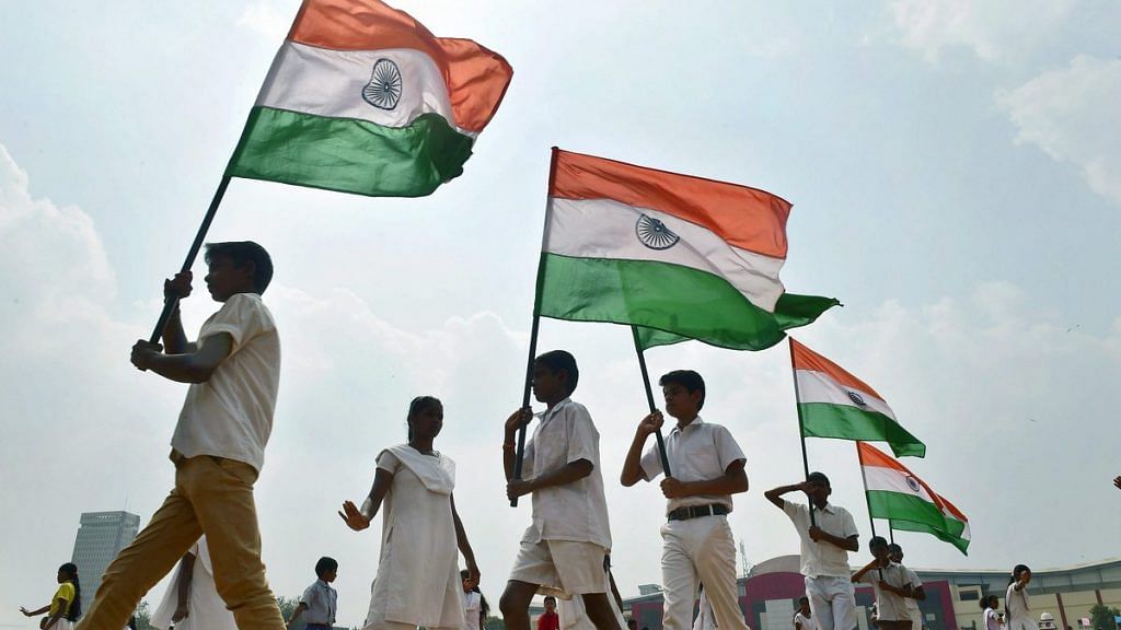 School children carrying Indian flags
