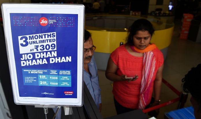 A customer buys Reliance Jio services at a Reliance Digital store in Mumbai
