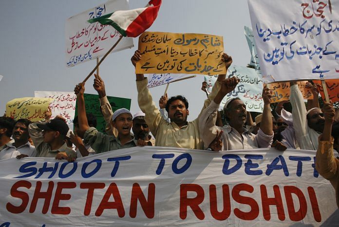 Protesters chant slogans to condemn Britain's knighting of Salman Rushdie