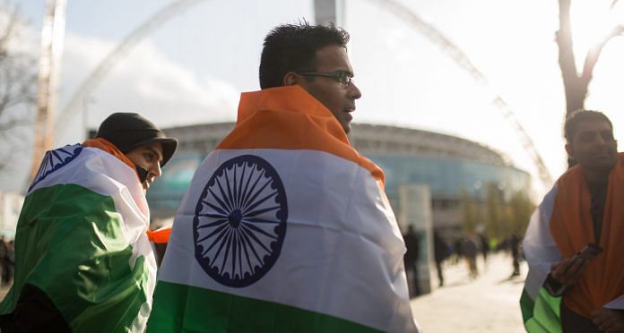 People wear the colors of the Indian flag