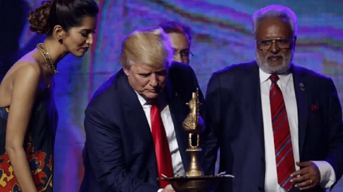Donald Trump lights a candle at a Hindu-American rally