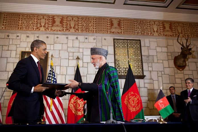 Former US President Barack Obama and former Afghan President Hamid Karzai