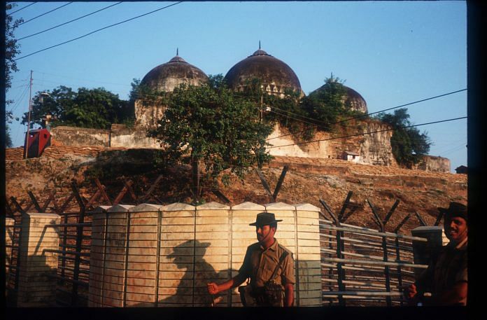 A member of the border security force guards the Babri Masjid |Robert Nickelsberg/Liaison