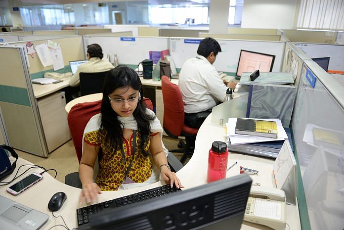 Women working in an office, PF cut in half Budget 2018