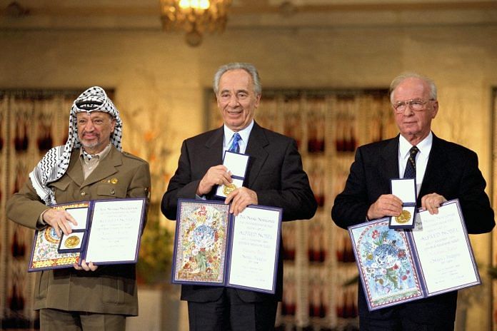 Yasser Arafat, Shimon Peres and Yitzhak Rabin receiving the nobel peace prize for 1994