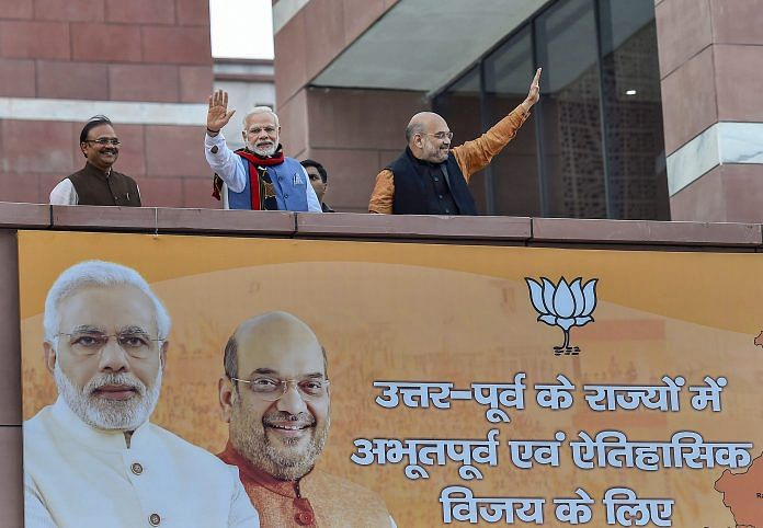 Prime Minister Narendra Modi and BJP President Amit Shah wave as they arrive at the party headquarters in New Delhi | Kamal Singh/PTI