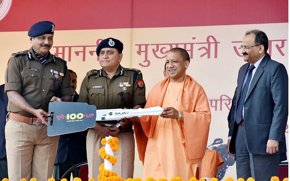 Uttar Pradesh CM Yogi Adityanath with DGP OP Singh and AGP Anand Kumar during the launch of UP 100 vehicles