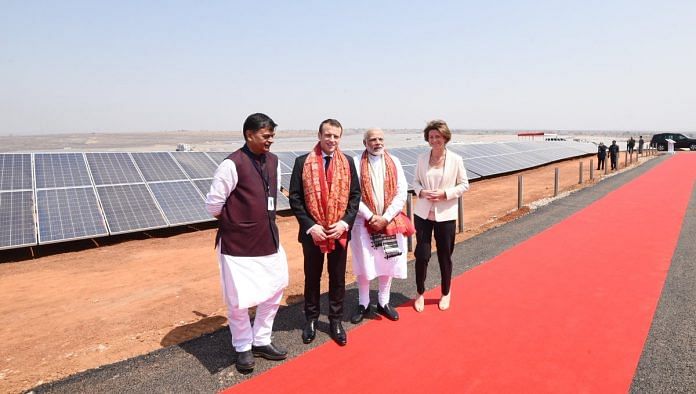 M Modi along with French President Emanuel Macron inaugurating a solar power plant in Mirzapur | @narendramodi