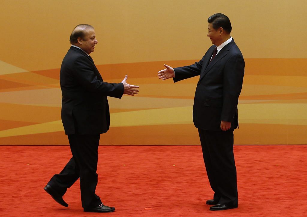 China's President Xi Jinping shakes hands with former Pakistani Prime Minister Nawaz Sharif