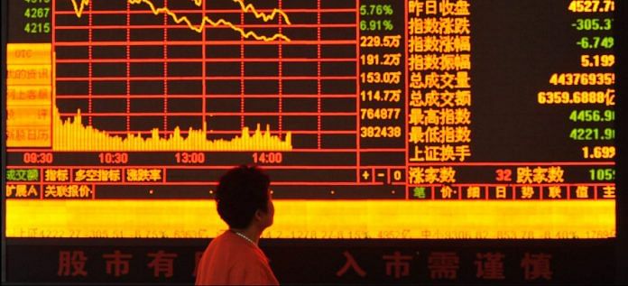 An investor observes stock market in China | Getty Images