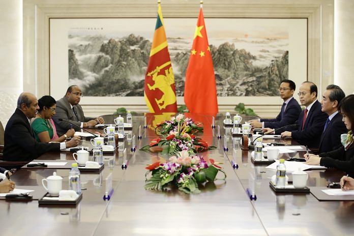 Chinese Foreign Minister Wang Yi and Sri Lanka's Foreign Minister Tilak Marapana on 30 October 2017