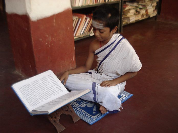 A child learning religious scriptures