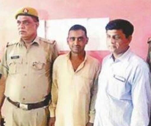 Nadeem with two police officers