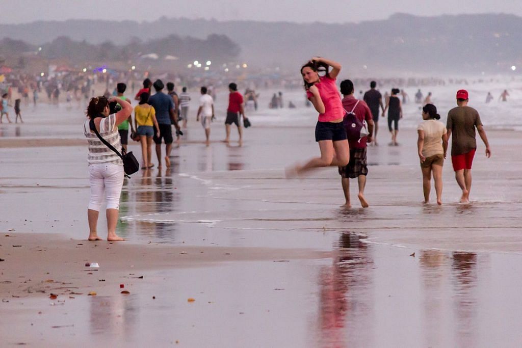 Tourists at a beach in Goa