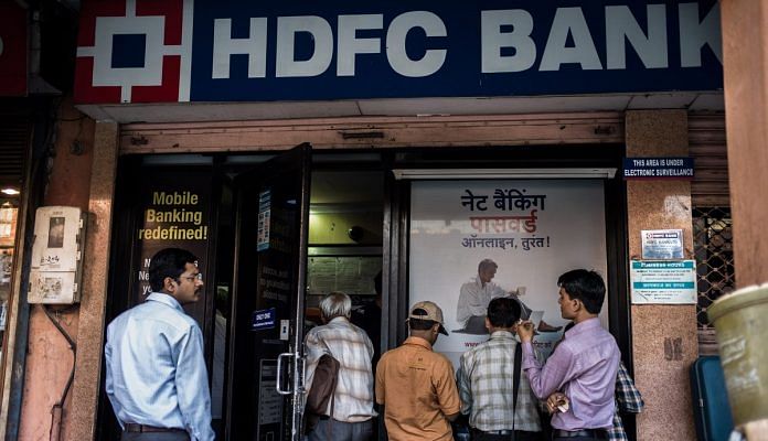 File photo of people lining up outside an HDFC Bank ATM| Bloomberg