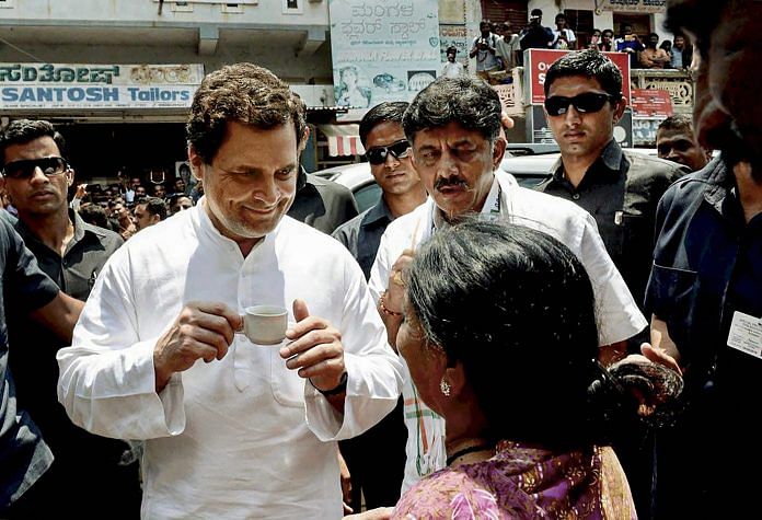 Congress President Rahul Gandhi interacts with a woman