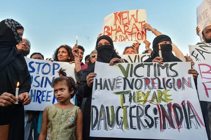 People take part in a candlelight march at the India Gate in protest over Kathua gangrape case | PTI