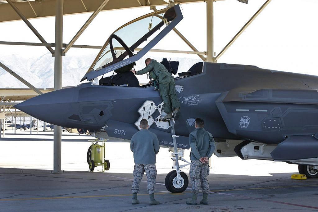 A fighter pilot climbs into the cockpit of a Lockheed Martin Corp. F-35A jet