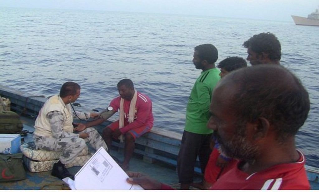 The rescued Indian fishermen being given medical aid by officials of the Pakistan navy